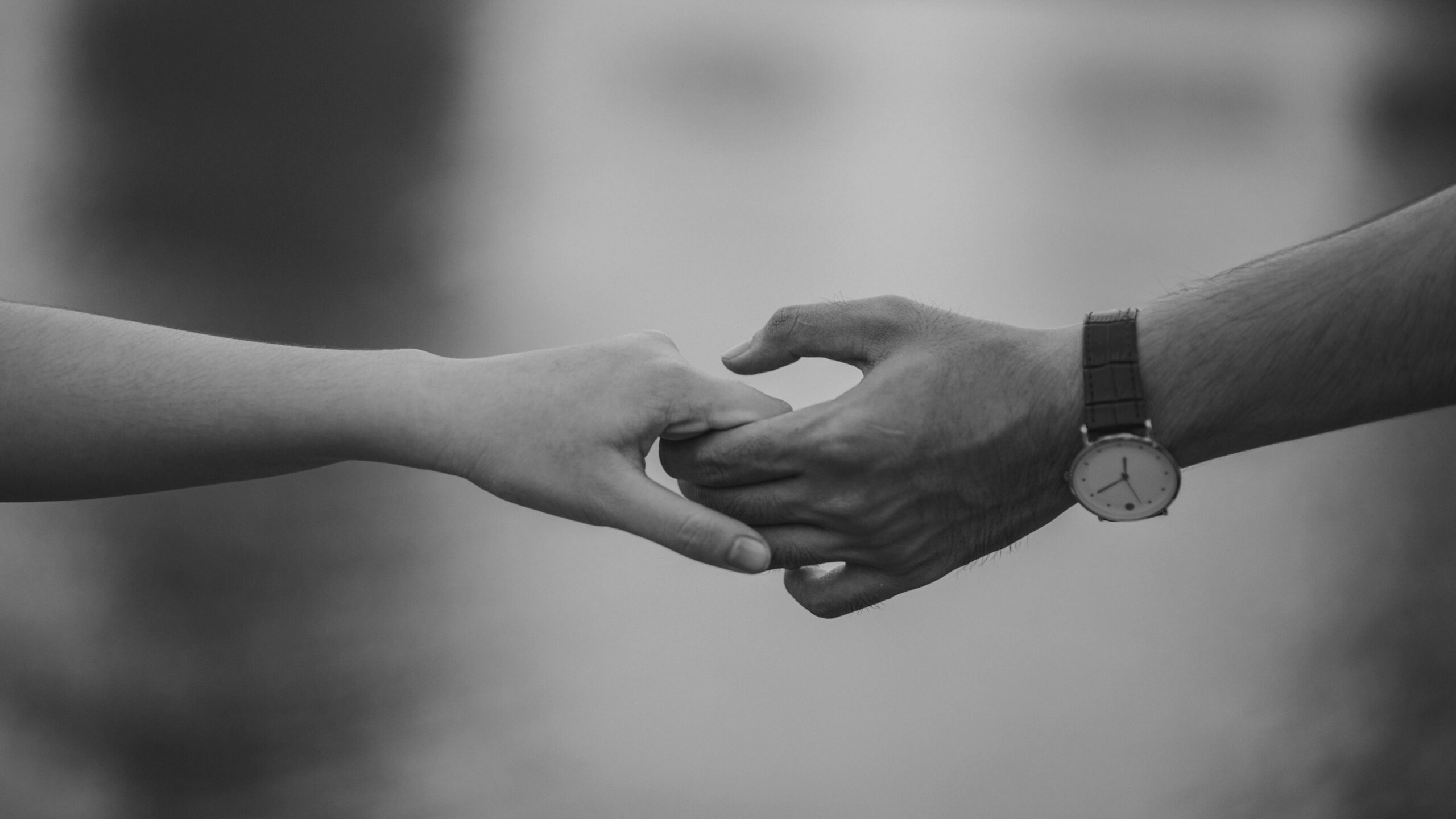 photo of couple holding hands
